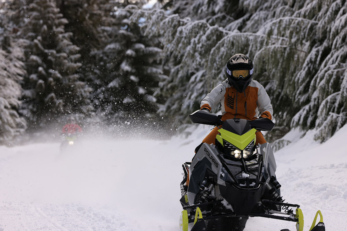 woman riding snowmobile